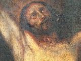an oil painting of a man on a cross with his arms raised