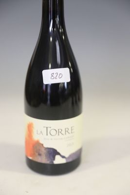 a bottle of wine that is sitting on a table
