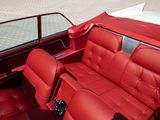 a red leather seat in the back of a red car