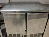 a stainless steel counter top in a commercial kitchen