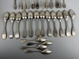 a lot of spoons and spoon spoons on the table