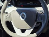 the interior of a car with a steering wheel and dashboard controls