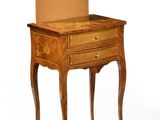 a small wooden table with a drawer on top of it