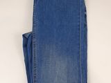 the back of a pair of blue jeans on a white surface