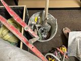 a pile of skis and ski poles sitting on the floor