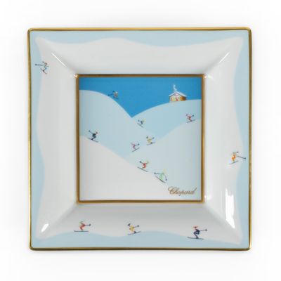 a picture of a plate with a picture of skiers on it
