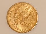 an image of a gold coin on a white surface