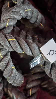 a close up of a rope with a tag on it