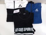 trois t-shirts portant l'inscription « Le Coq Sport » en blanc, bleu et noir