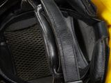 the helmet is yellow and black with a black visor