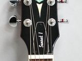 the neck of a guitar with a black fret and a green star on it
