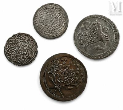 four different types of coins are shown on a white surface