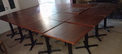 four tables that are sitting in front of a fire place