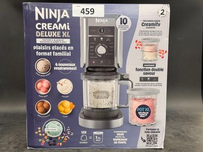packaging of a blender with a blender in it sitting on a counter