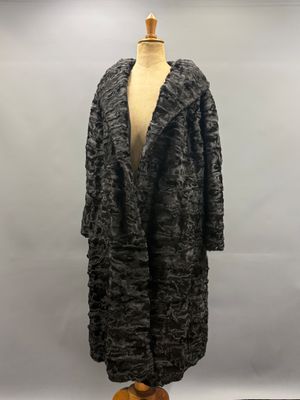 the coat is black and white and has a fur collar