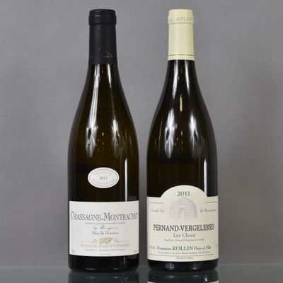 two bottles of wine sitting on top of a table next to each other