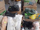 a pile of boxes with shoes and other items in them