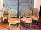 three chairs are sitting in a room with a rug on the floor