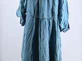an image of a blue dress on a mannequin stand