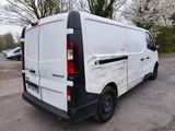 a white van that is parked in a parking lot