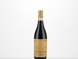 a bottle of red wine sitting on top of a table