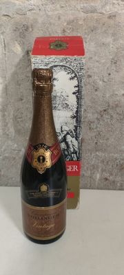 bottles of champagne and a box on a white table