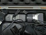 a case with a hair brush, comb, and other items in it