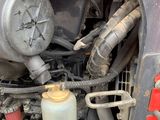a close up of a truck engine with a lot of hoses