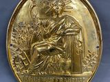 une image représentant une médaille d'or sur laquelle figure Jésus