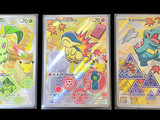 Trois cartes à collectionner Pokémon sont représentées sur un fond noir