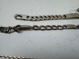 two chains that are laying next to each other on a table