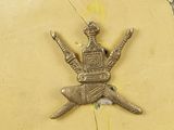 a picture of a metal object on a yellow wall