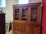 an image of a room with a china cabinet and a piano