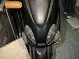 a motor scooter that is parked in a garage