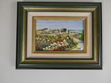framed oil painting of a beach scene with a house in the distance