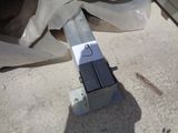 a piece of metal that is laying on the ground