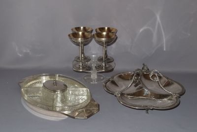 a silver plate with a silver spoon and a silver plate with a silver spoon and a silver plate with a silver spoon and a silver plate with a silver