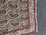 a rug on the ground with a cat laying on it