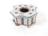 a small white box with a blue and orange design on it