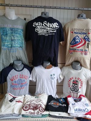 many t - shirts on display in a store