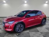 a red 2020 hyundai kona is parked in a large room
