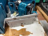 a picture of a blue and white machine in a factory