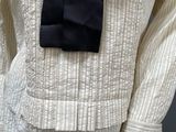 a white shirt with a black tie on a mannequin mannequin