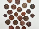 a pile of old coins sitting on top of a white surface