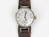 une image d'une montre-bracelet avec un bracelet en cuir marron