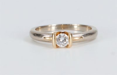 an image of a diamond ring on a white surface