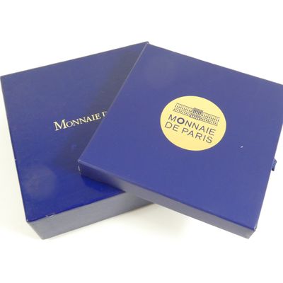 the box is blue and has a gold logo on it