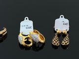 several different types of jewelry are displayed on a black surface