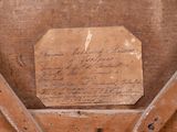 a piece of paper on top of a piece of wood