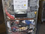 a metal cart with a bunch of items in it